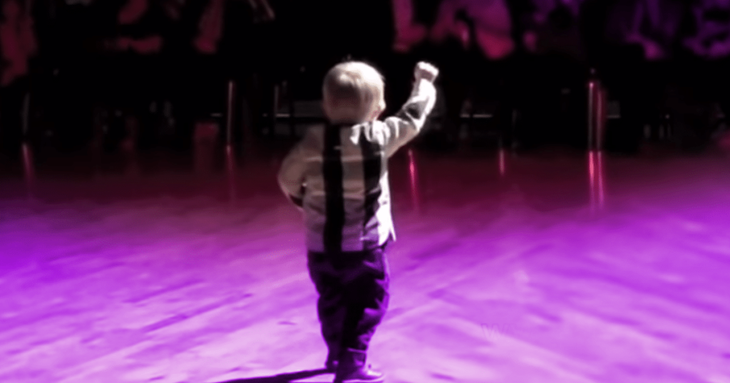 A child rushes to the dance floor as he hears his favorite Elvis song, making the King PROUD